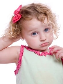 Little girl itching scalp